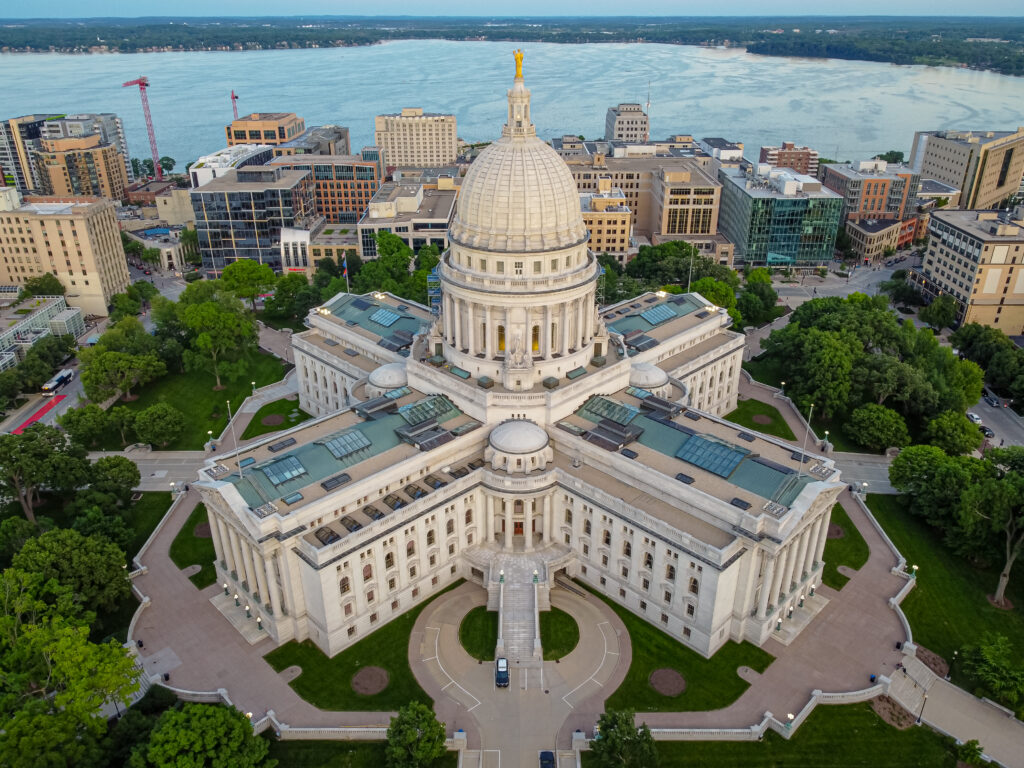 Aerial view of a state capitol building with a domed roof