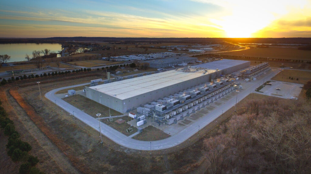 Aerial view of a data center facility at sunset
