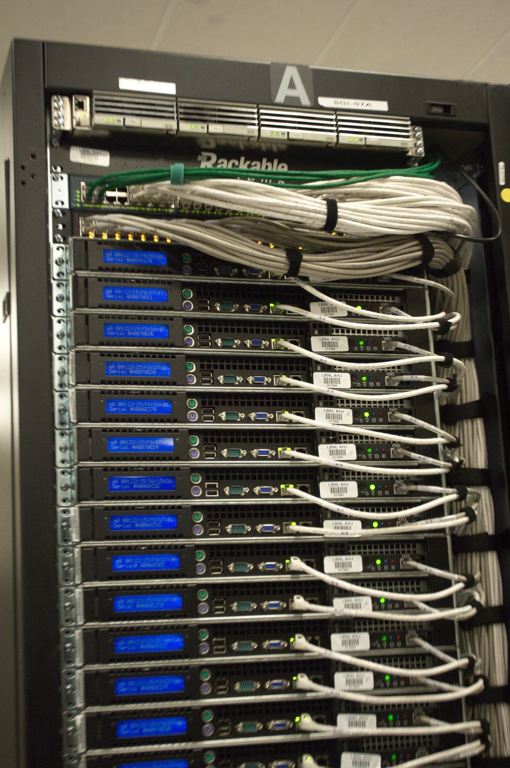 Server rack with active status indicator lights in a data facility
